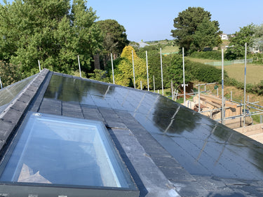 Roof with solar panels and scenic background